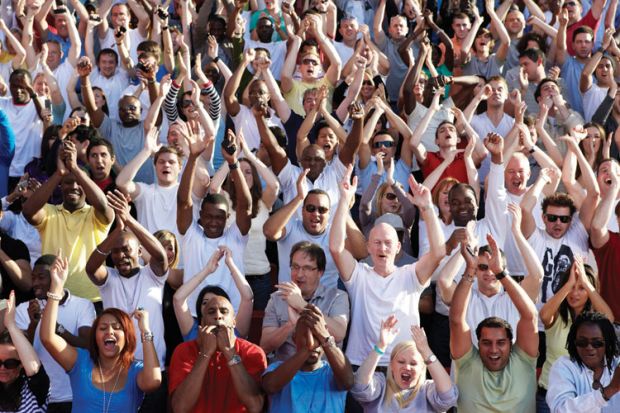 Crowd of people cheering