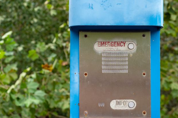 Emergency button, info button and speaker on a blue emergency light post