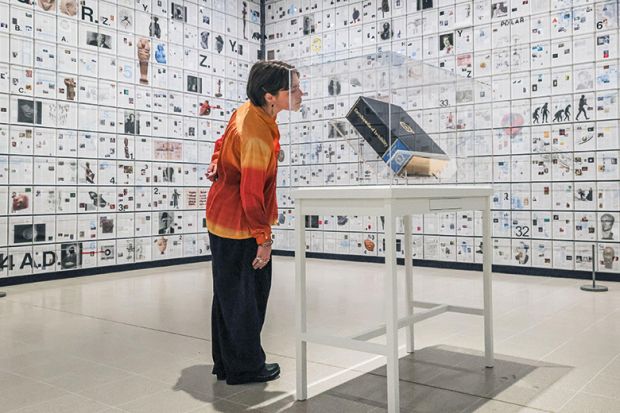 Art exhibit showing an encyclopedia. As an illustration of how the The Literary Encyclopedia could be considered as a financing mechanism for academic journals