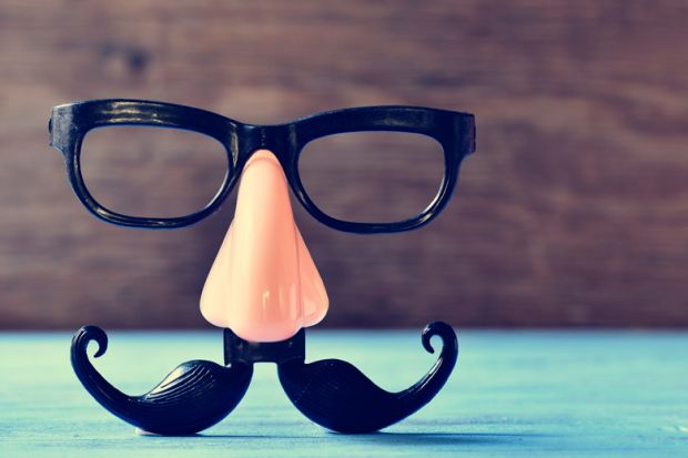 Fake nose and moustache eye glasses placed on table