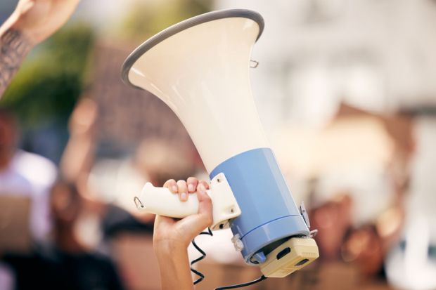 A megaphone held aloft, symbolising free speech