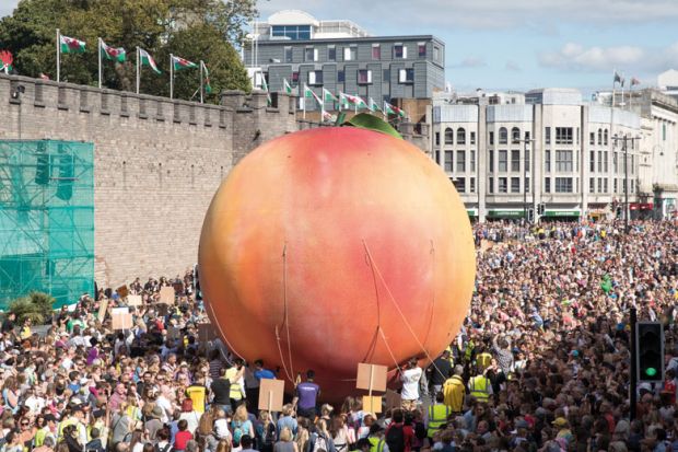 Giant peach being moved through Cardiff streets