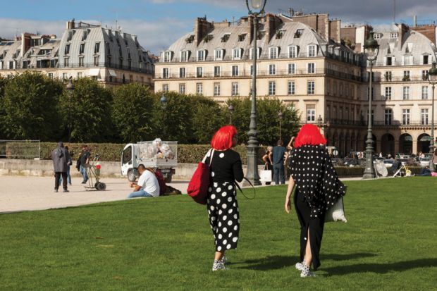 Women with matching clothing and hairstyles