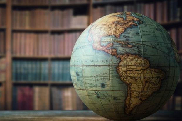 A globe in a library, symbolising internationalisation of higher education