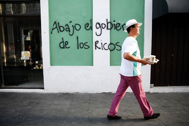 Graffiti in Puerto Rico read ‘Down with the government of the rich’