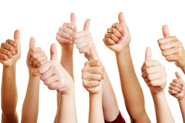 Group of hands with thumbs-up