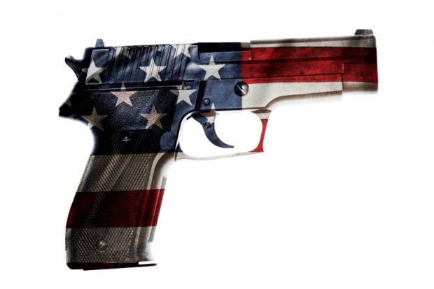 A gun with the colours of the US flag