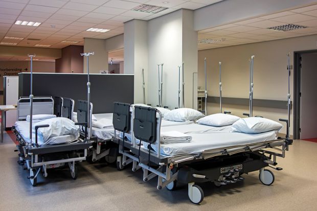 A cluster of hospital beds