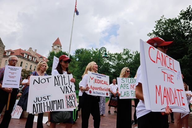 Anti-vaxxers and anti-maskers gathered at Indiana University’s Sample Gates to protest against mandatory Covid vaccinations