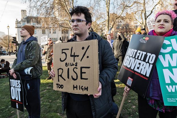 Demonstrators protest in Parliament Square against rising prices and stagnant wages in London, February 2022