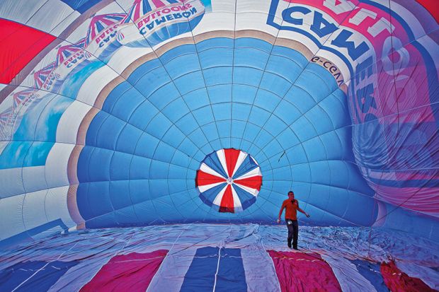 Man inside a hot air balloon to suggest reversing higher education expansion in England