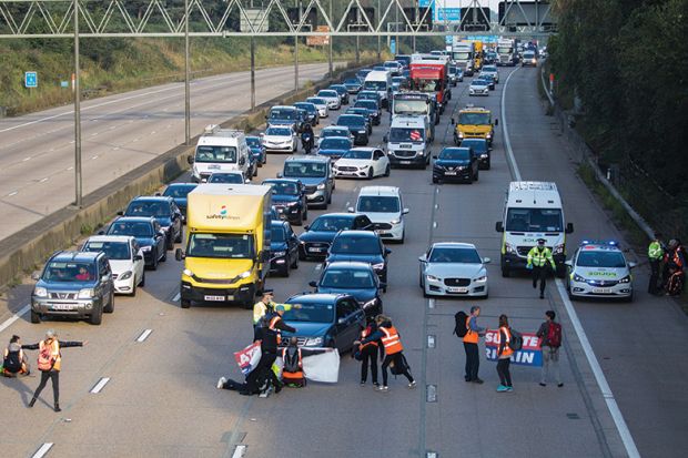 Insulate Britain climate activists begin to block the M25 to illustrate story about how researchers need to tread with caution when engaging with activists
