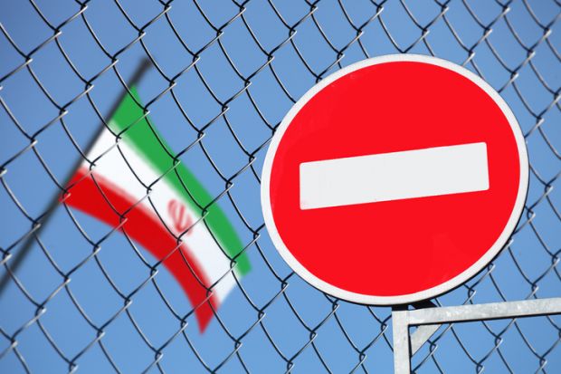 A no entry sign next to an Iranian flag symbolising restricted academic freedom
