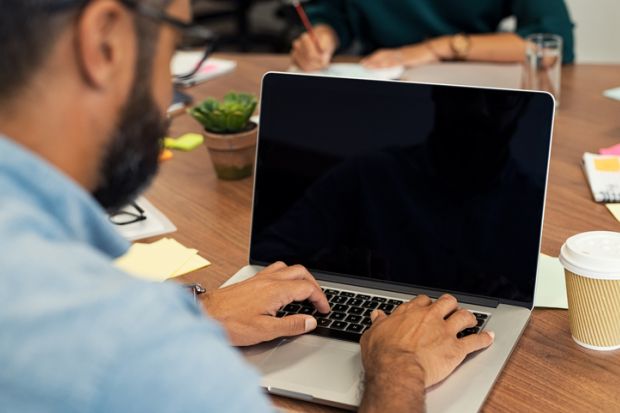 Businessman typing on blank screen