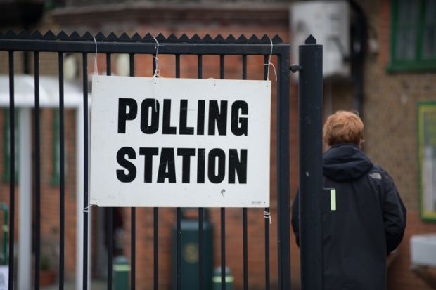 Someone walks into a polling station 