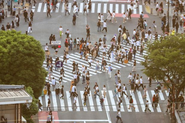 A confusing jumble of pedestrian crossings on a major urban road