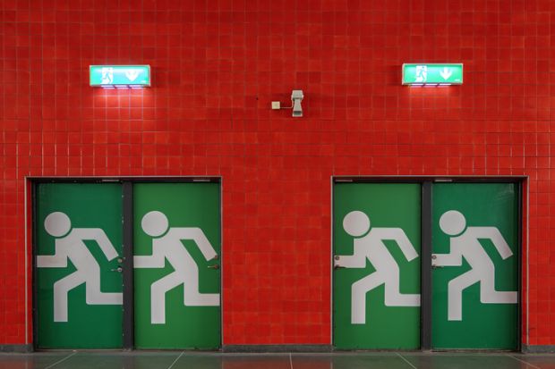 Exit signs at an underground station