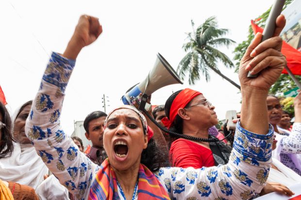 People in central Dhaka gather on the street to demonstrate for better workers rights in 2014.