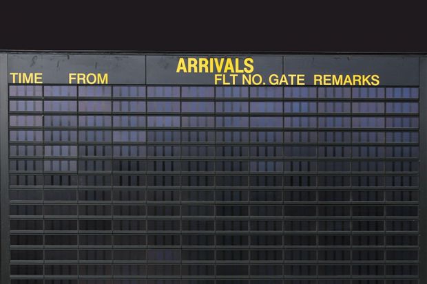 Empty arrivals board illustrating Australia’s closed borders, international students