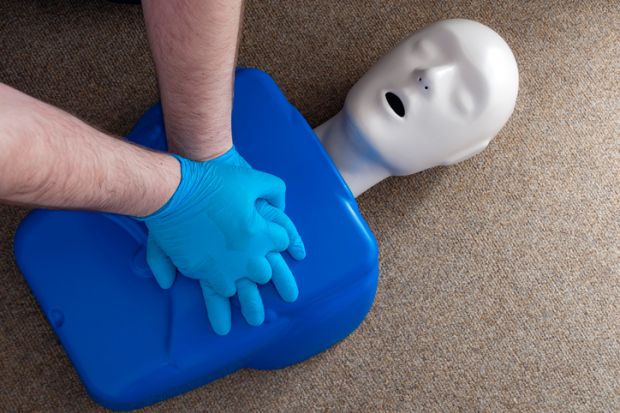 Doctors perform CPR on a manikin