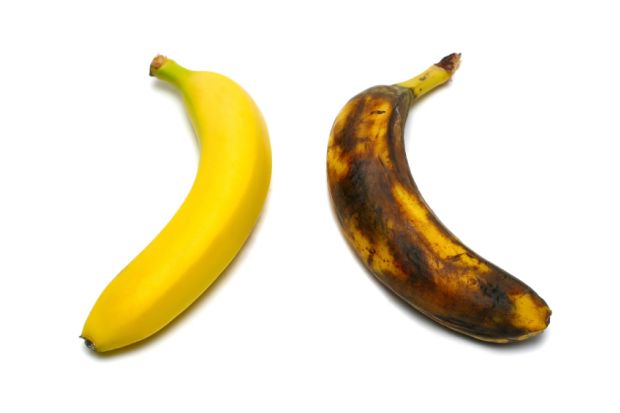 Two bananas: one yellow, one brown