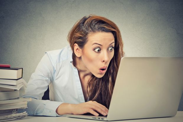 Shocked woman at computer