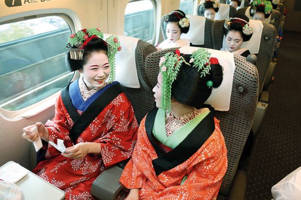 Japanese geishas on train