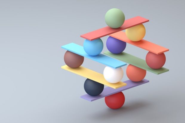 A jenga-type game with balancing balls, symbolising Dutch science policy