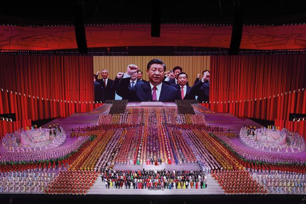 A large screen showing President Xi Jinping during the art performance celebrating the 100th anniversary of the founding of the Communist Party of China on June 28, 2021 in Beijing, new Cold War.