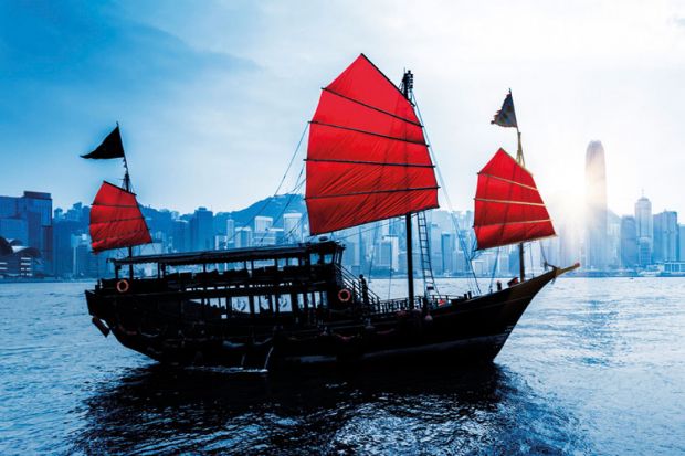 Junk sailing in Hong Kong harbour