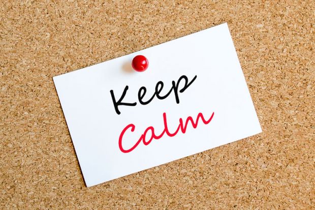 'Keep calm' note pinned to corkboard