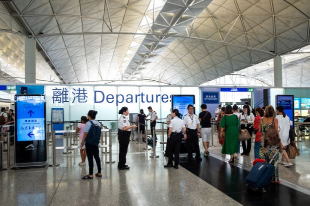 Lantau, Hong Kong - August 05, 2018  Passengers carries luggage at Hong Kong International Airport