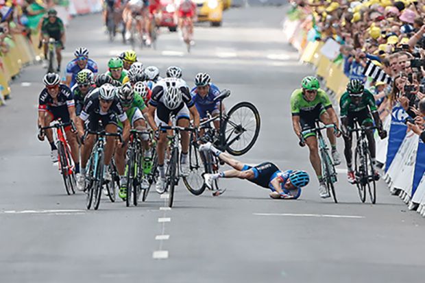 Garmin-Sharp team rider Andrew Talansky of the U.S. crashes during  the Tour de France cycling race 