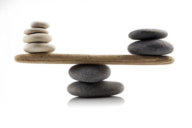 Stones balanced on a see-saw, symbolising the UK government's levelling up agenda