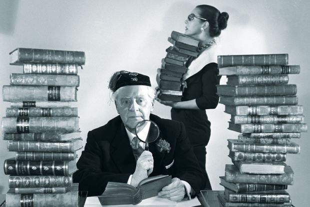 Librarians with piles of books