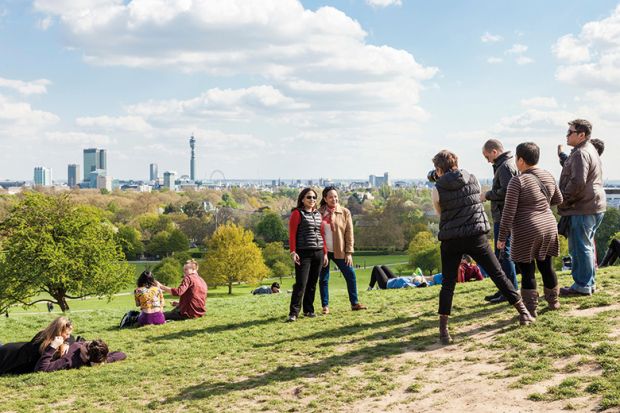 People photographing friends, Primrose Hill, London