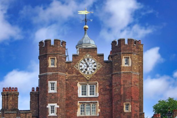 London, England - July 30, 2013 Close-up view of the tower of St. James Palace, with the clock and weather vane