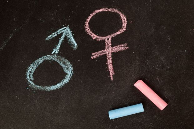 Male/female gender symbols drawn in chalk