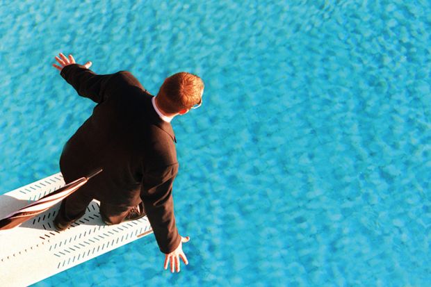 Man in suit on diving board