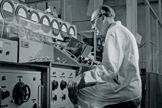 Man inspecting Keystrian magnetious valves at Mullard