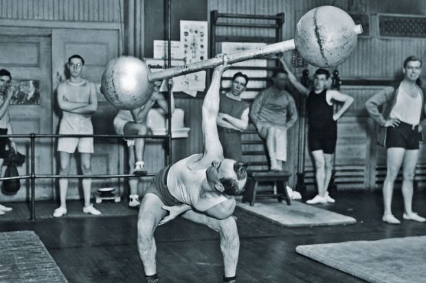 Man lifting barbell one-handed