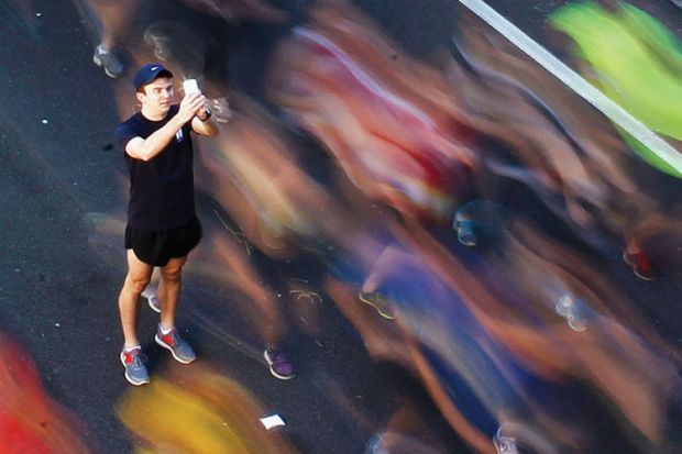 Man takes picture, City2Surf fun run, Sydney, Australia, 2013