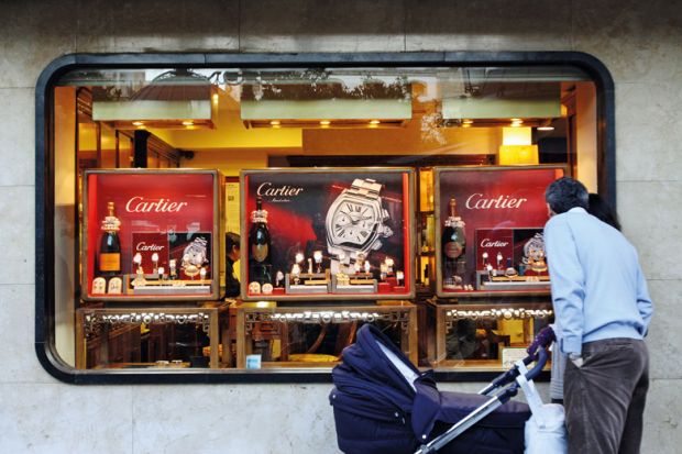 Man window shopping for Cartier watches, Córdoba, Spain