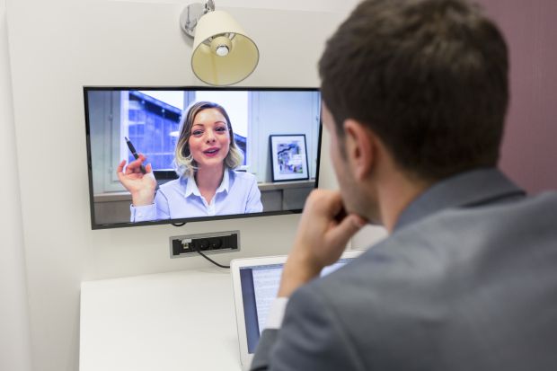 Man and woman videoconferencing