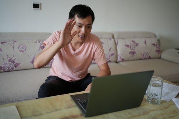 man having video conference at home