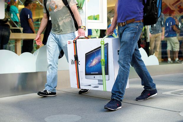 Two men carrying a TV