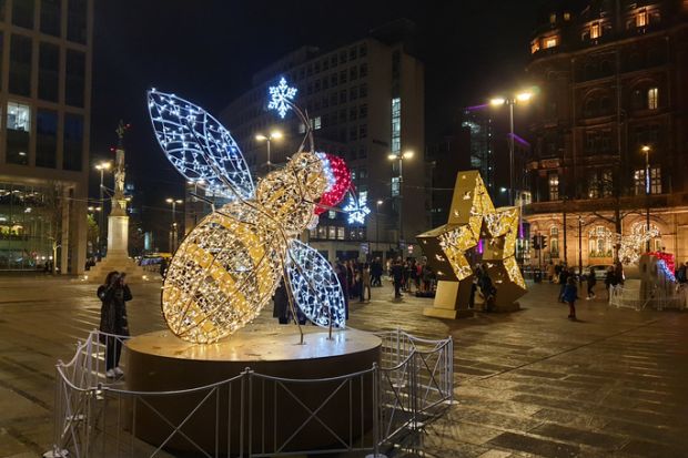 Manchester, United Kingdom - November 23, 2019 Christmas lights of the Manchester bee illuninating St Peters Square in Manchester city centre.