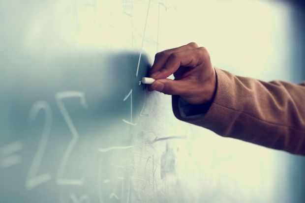 Man&#039;s hand drawing on blackboard