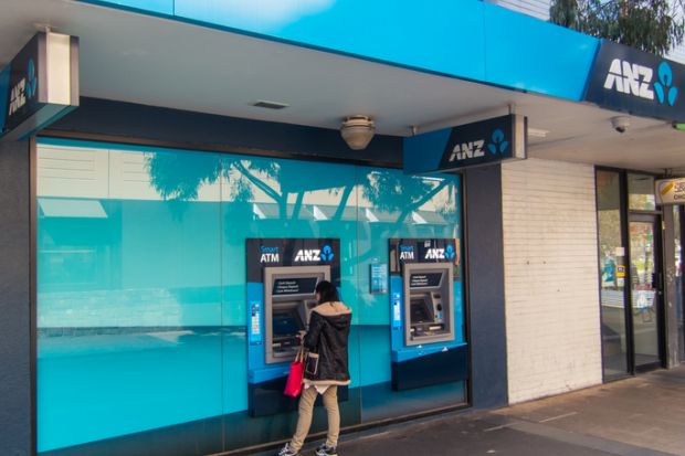 Melbourne, Australia - August 22, 2014 a woman accessing cash from the automatic teller machine outside the Box Hill branch of the ANZ Bank in suburban Melbourne. The ANZ is Australia's third largest bank by market capitalization.