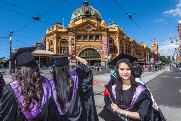 Melbourne, Australia - December 17, 2014 - RMIT university graduation day - the students walk along the Swanton St in Melbourne city for celebration day in graduation day